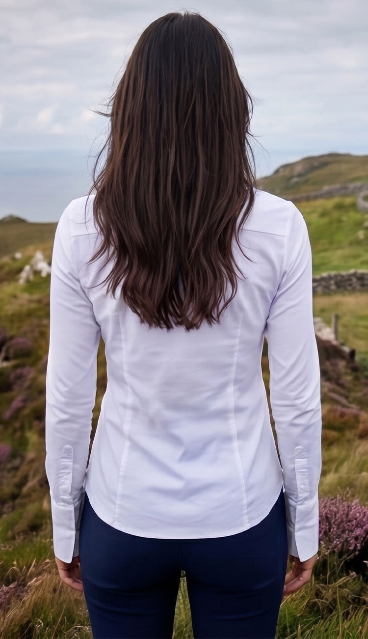 Woman wearing the Alida Anatomie Shirt in white with a navy pant. - back view