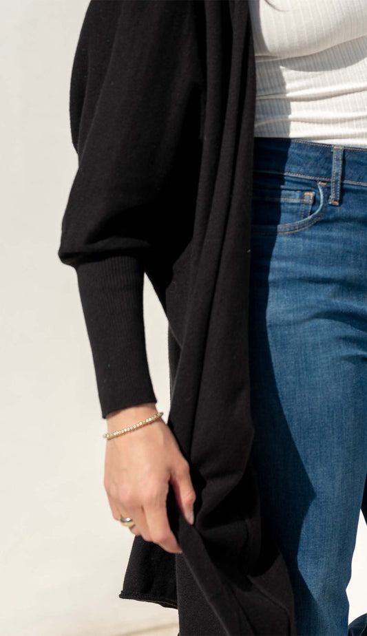 Chelsea Kimono in black on a model wearing jeans and a white tee, showing the detail of the sleeve