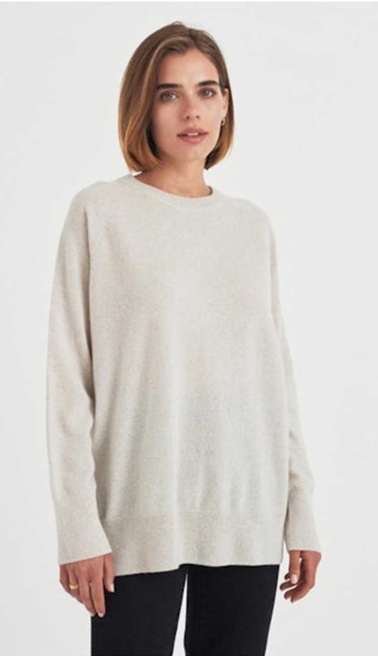 white and warren boyfriend sweater on model in parchment heather cashmere on a white background
