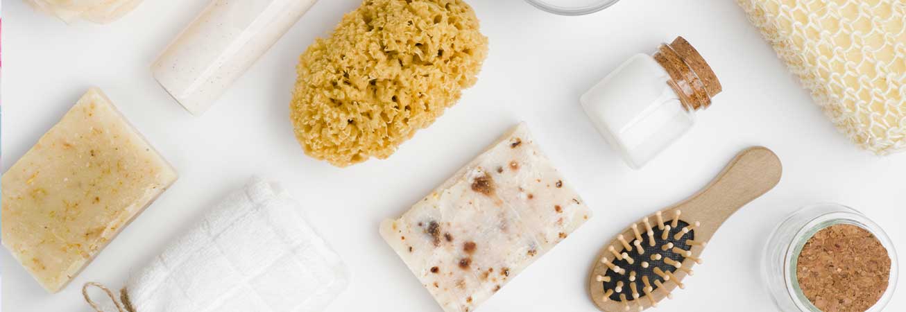 collecion of natural sponges, brushes, soap and bath salts