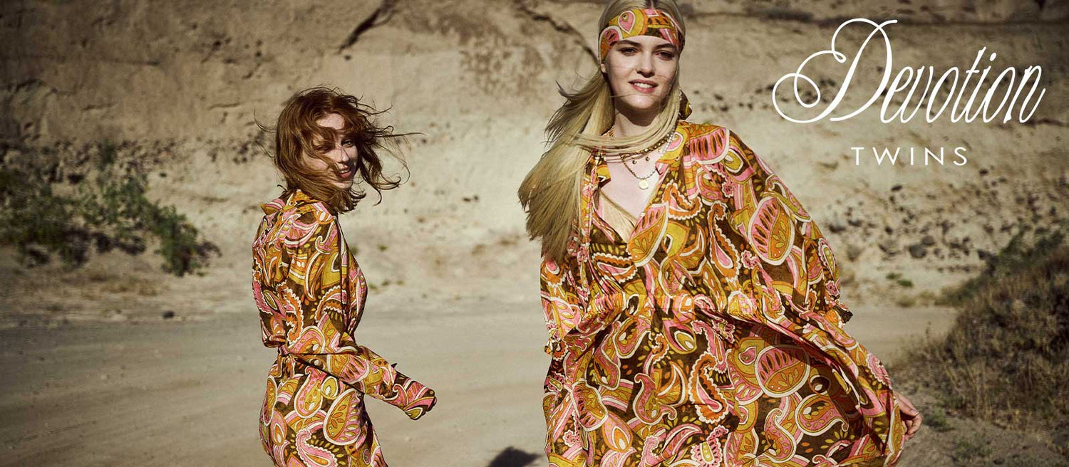 Devotion Twins, women wearing floral print dresses and head scarf 