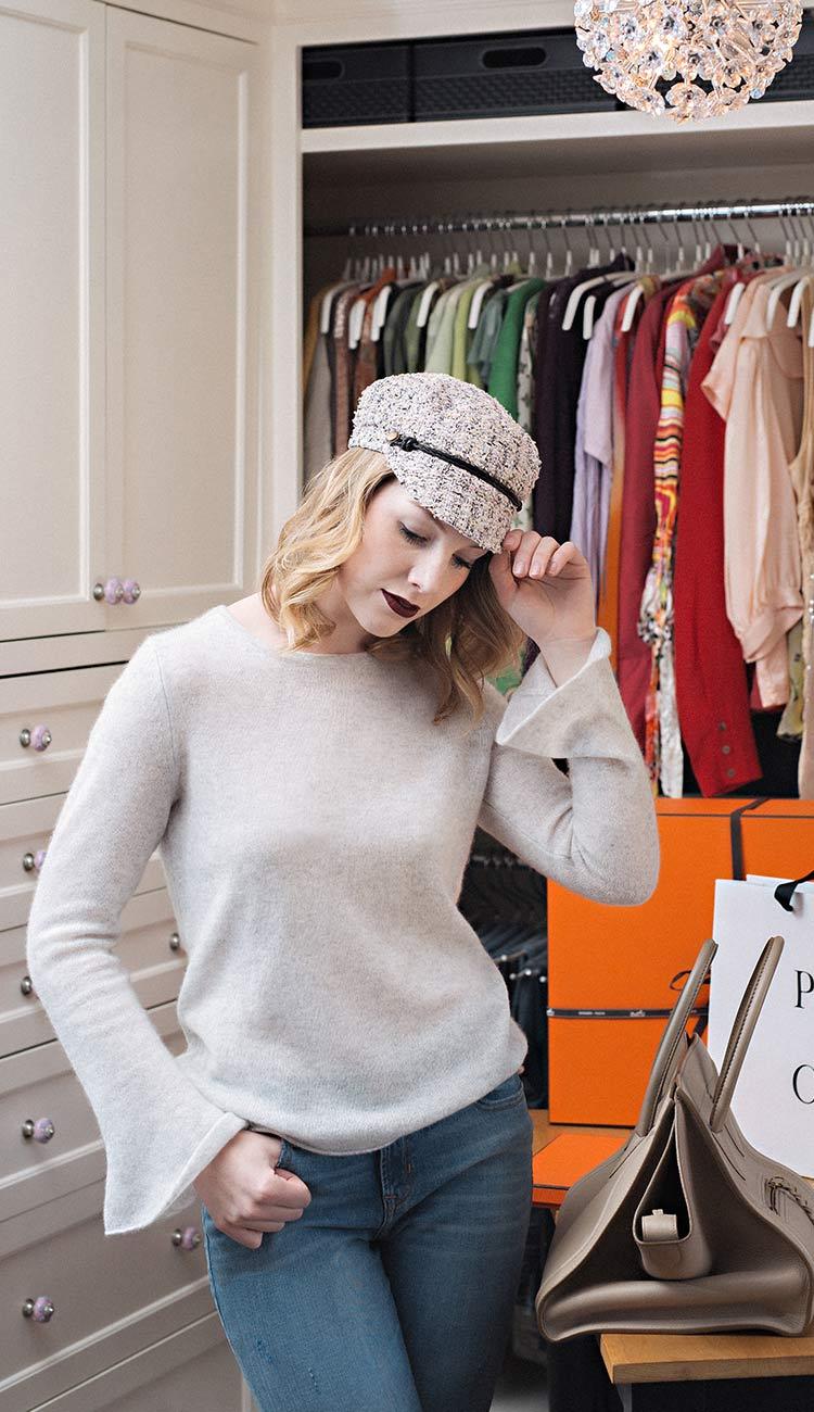 woman wearing a white and warren cashmere sweater with cap