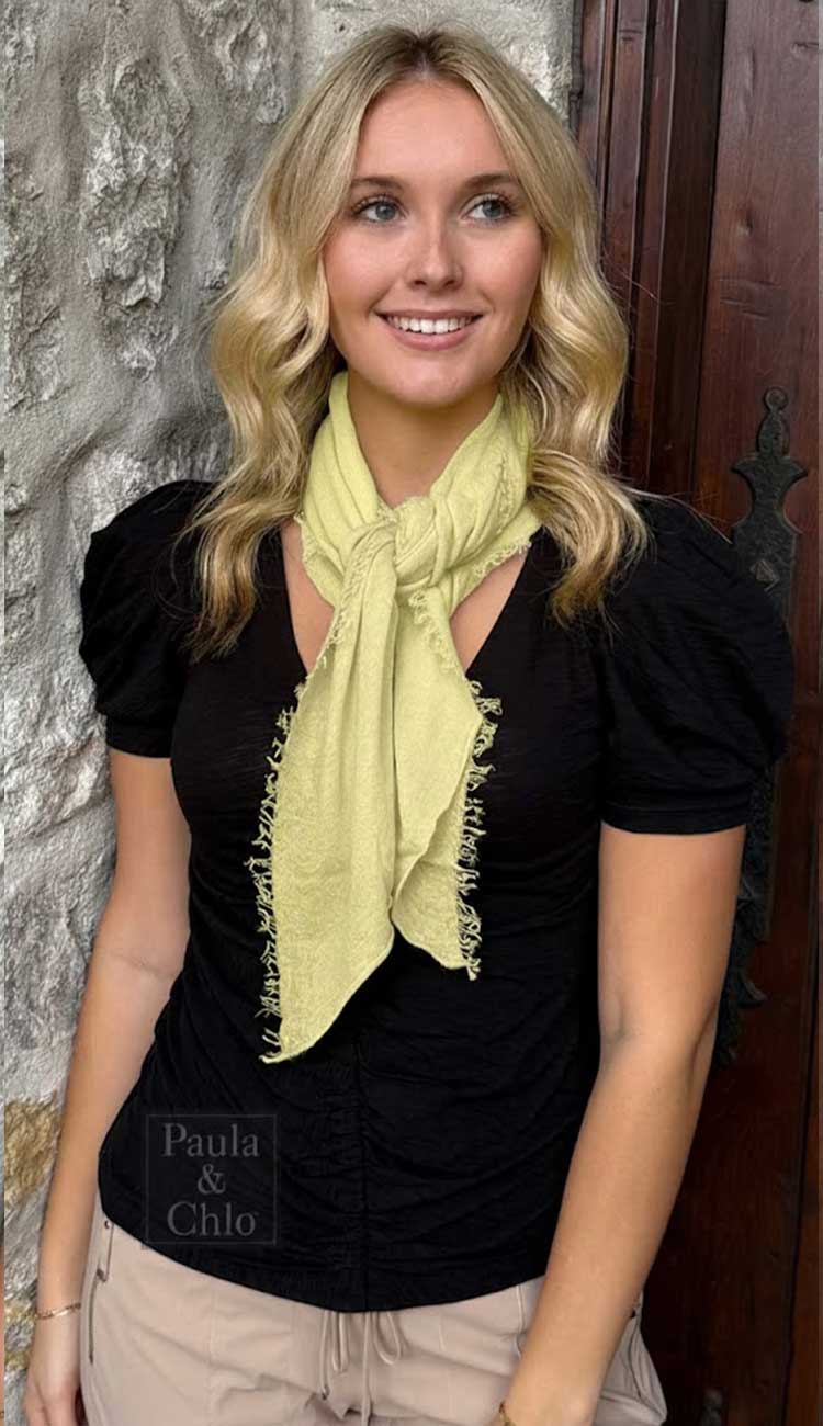 Woman modeling a Grisal Mini Love lightweight cashmere scarf.