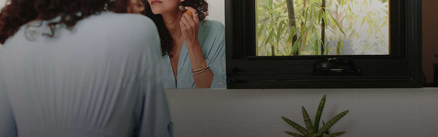 woman wearing Yala organic bamboo jersey robe in mint green