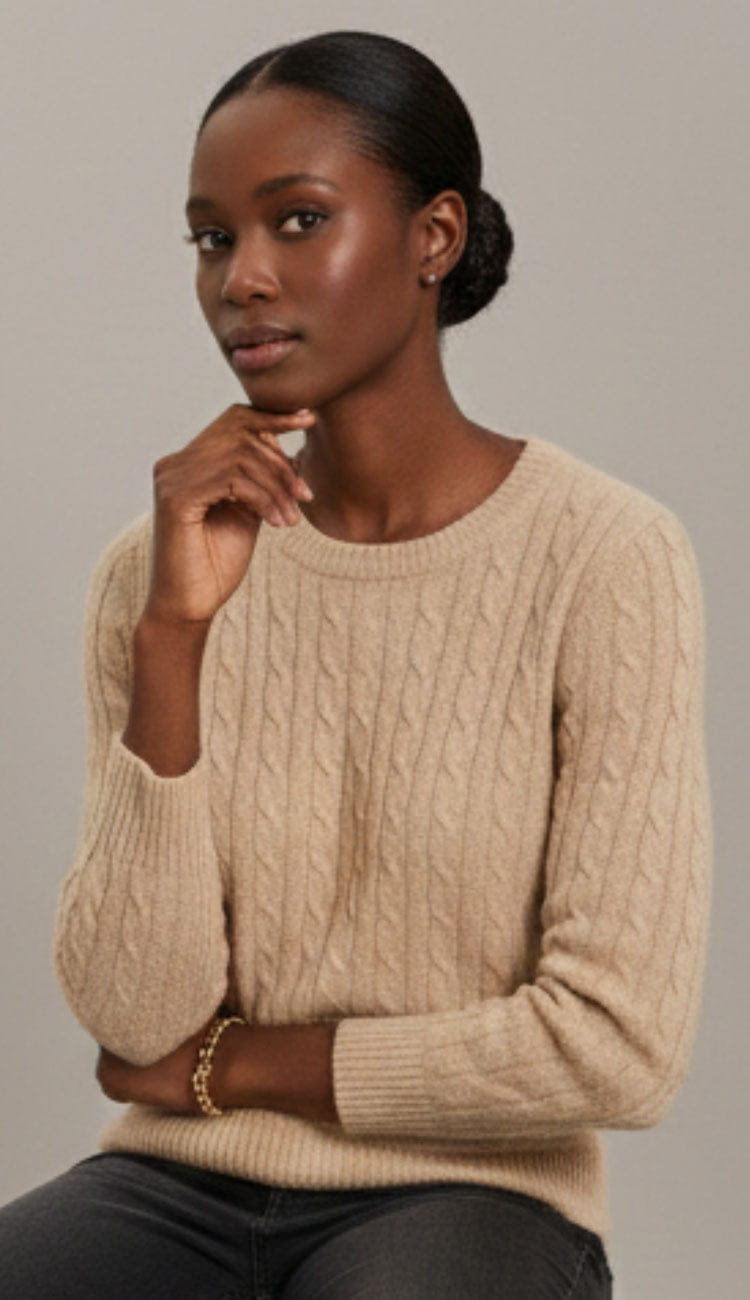 Front view of a woman's Alashan  Cashmere Breezy Cable Pullover. The image shows the crew neck, long sleeves, and the detailed vertical cable knit pattern extending down the center and sides of the 100% cashmere sweater