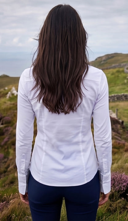 Woman wearing the Alida Anatomie Shirt in white with a navy pant. - back view
