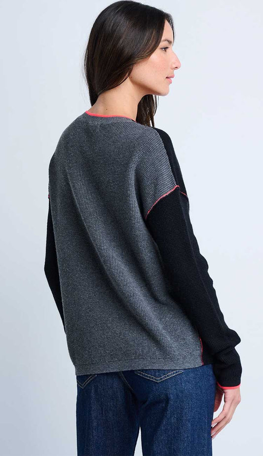Woman wearing a Black sweater with a gray back panel  - by lisa todd