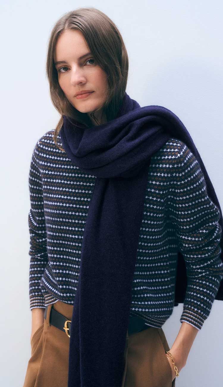 White + Warren cashmere travel wrap in Deep Navy Blue, a lightweight rectangular 100% cashmere wrap styled as a scarf.