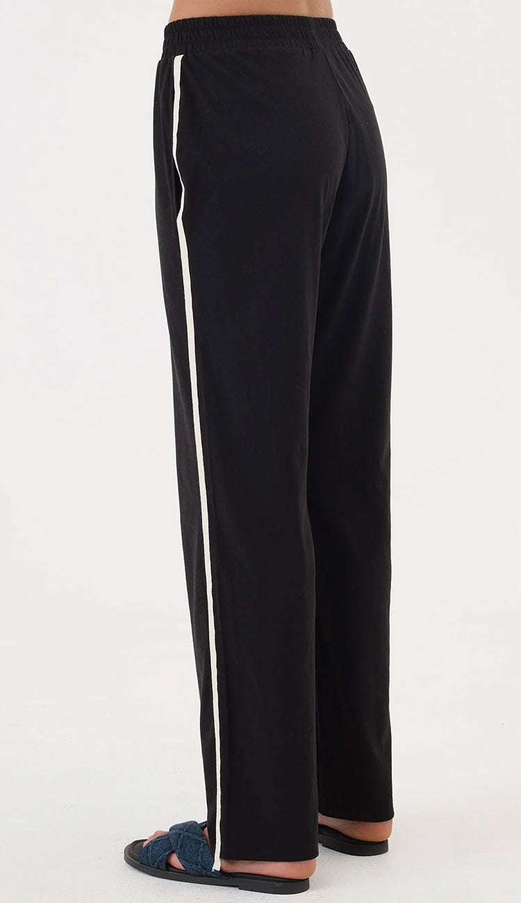 Goldie Everyday Black pants with white stripes on a white background - back view