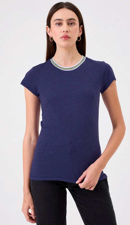 Goldie Ringer tee in navy on a model wearing black pants on a white background