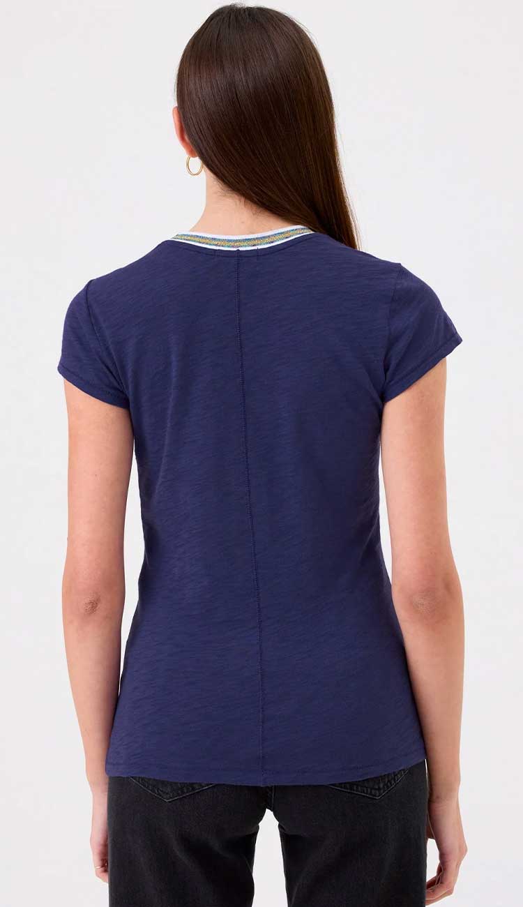 Goldie Ringer tee in navy on a model wearing black pants on a white background - back view