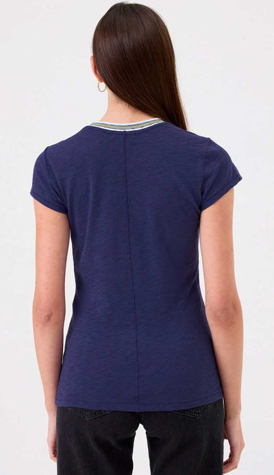 Goldie Ringer tee in navy on a model wearing black pants on a white background - back view