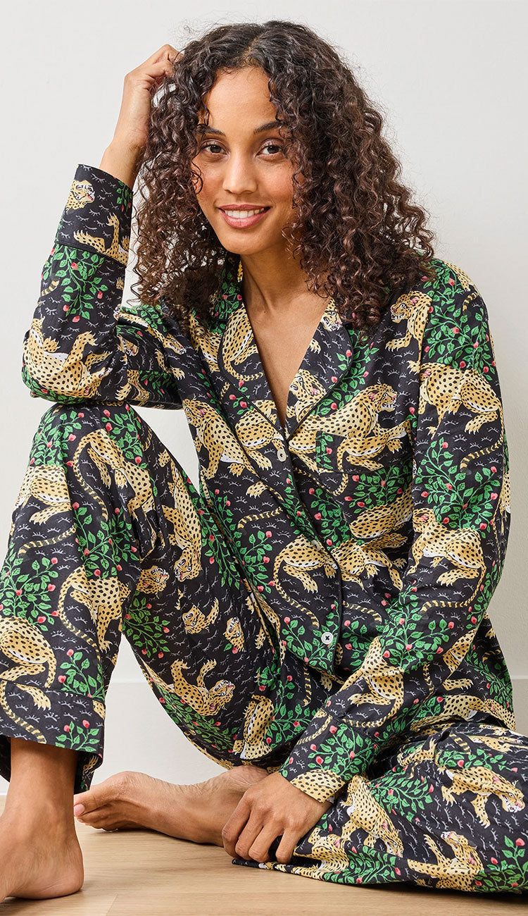 Printfresh Bagheera Organic Cotton Pajamas  - leopard print in Ink on a model on a white background - sitting on a wood floor