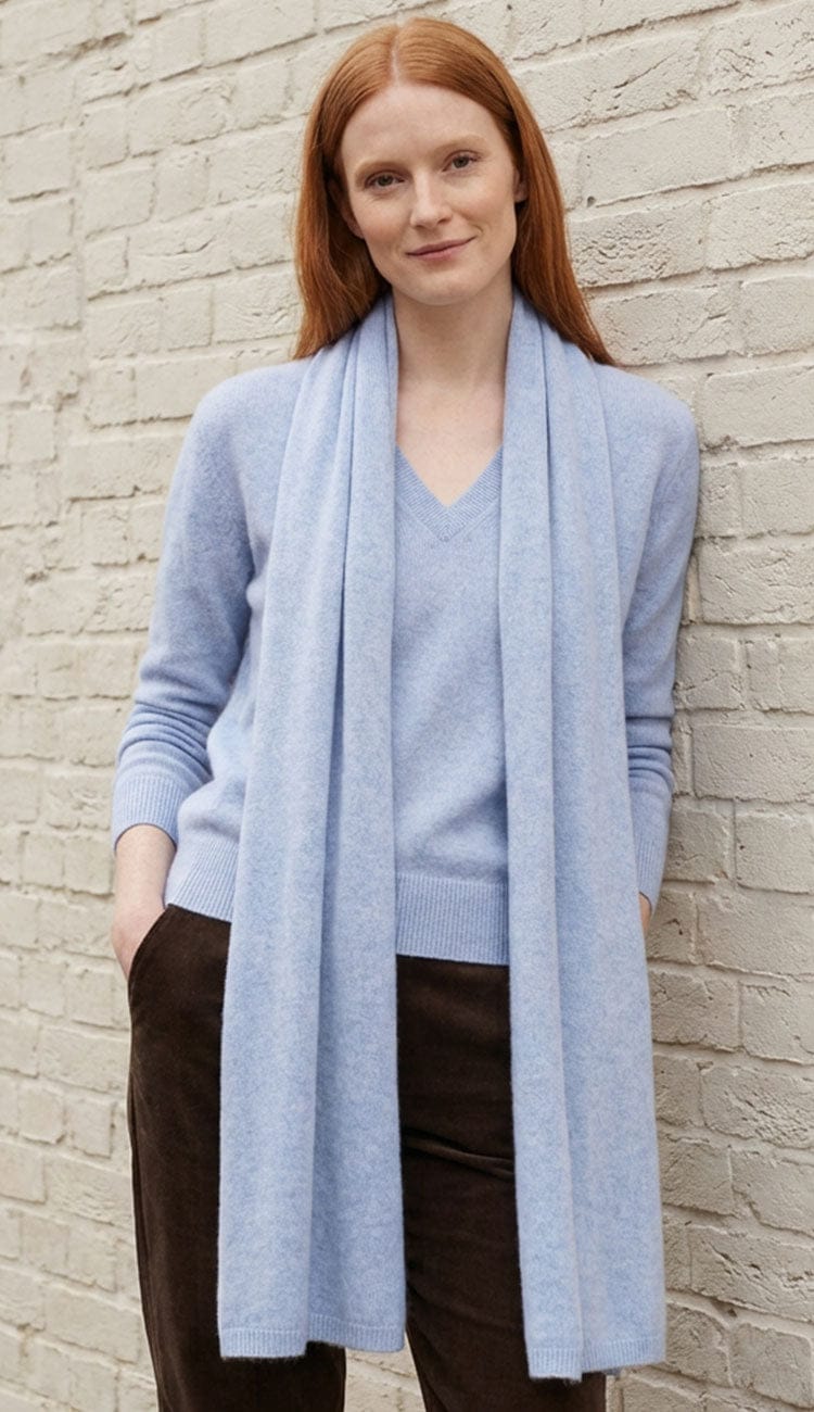 White + Warren cashmere travel wrap in Blue Vapor, a lightweight rectangular 100% cashmere wrap styled as a scarf.