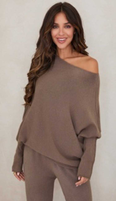 Woman wearing a Mocha brown off-shoulder top and pants against a plain background