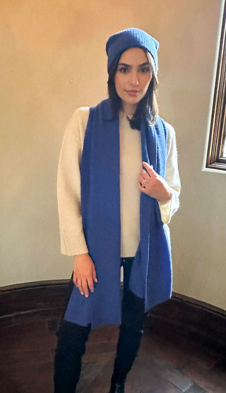 white and warren travel wrap and beanie in artic blue over white sweater