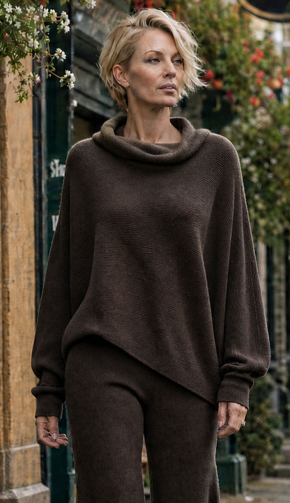 Woman wearing a  milio milano chocolate brown sweater with matching pants.