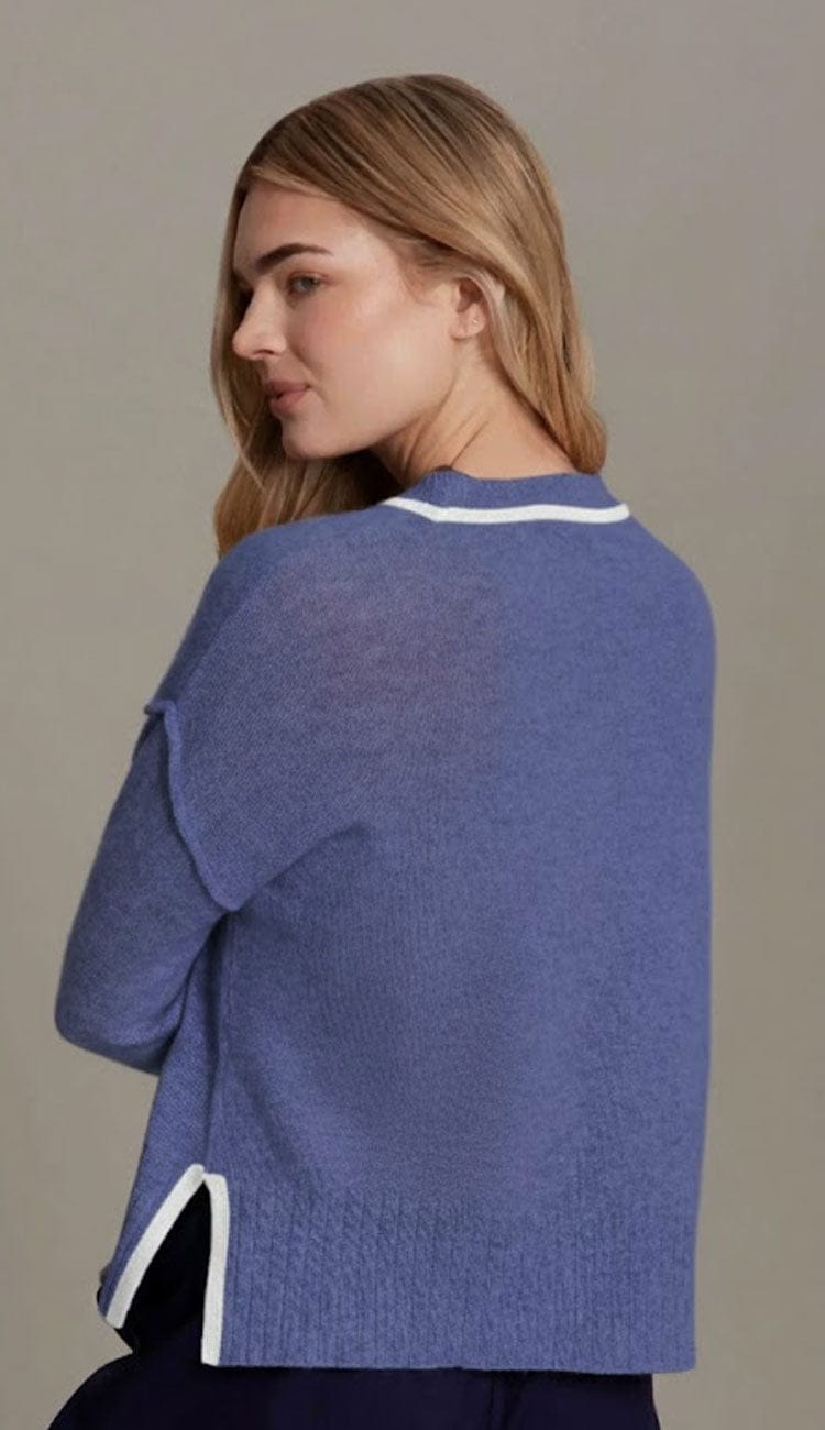 Back view of the Juliette Boxy Crewneck Pullover in Blue Bell featuring a contrasting color "tipping" detail at the neckline and side slits. The sweater has a relaxed, boxy fit with long sleeves and small side slits at the hem.