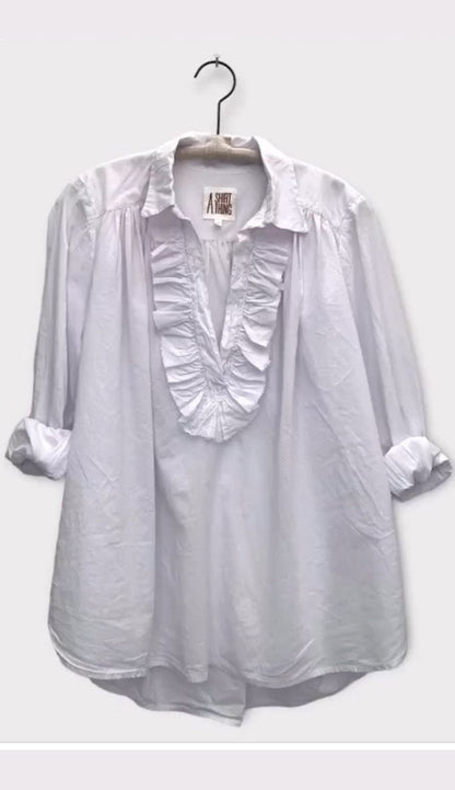 Celine Cabo shirt by A Shirt Thing at Paula and Chlo. Shown on hanger with rolled sleeves.