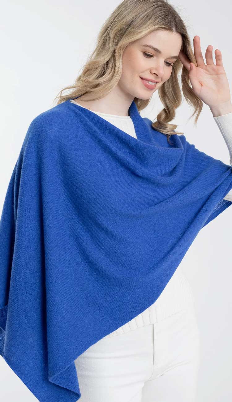 Alashan cashmere topper poncho in cruise blue lightweight one-size wrap with draped silhouette.
