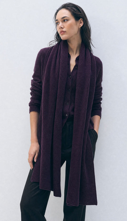 woman wearing white and warren deep plum travel wrap on a white background