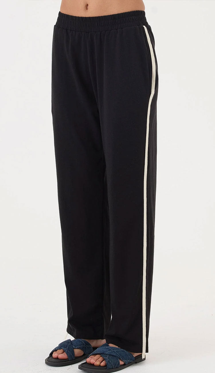 Goldie Everyday Black pants with a white stripe on a white background