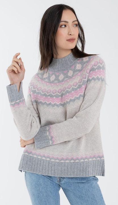 alashan cashmere faireisle sweater in shades of grey and pink with blue jeans