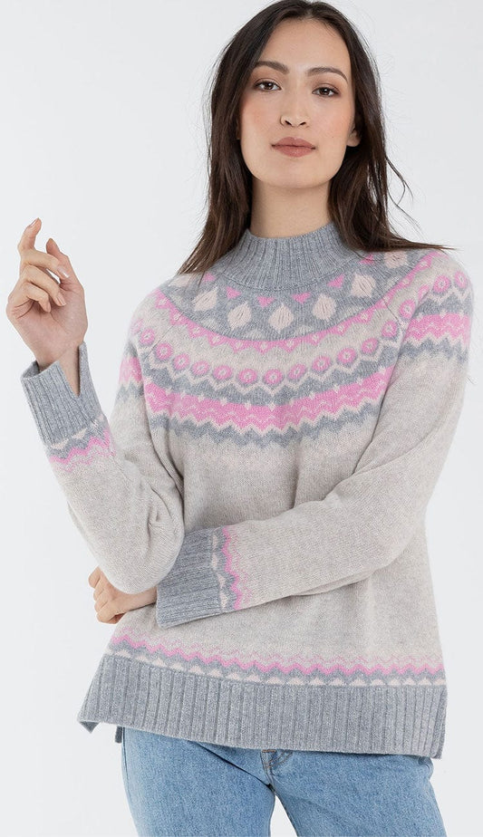 alashan cashmere faireisle sweater in shades of grey and pink with blue jeans