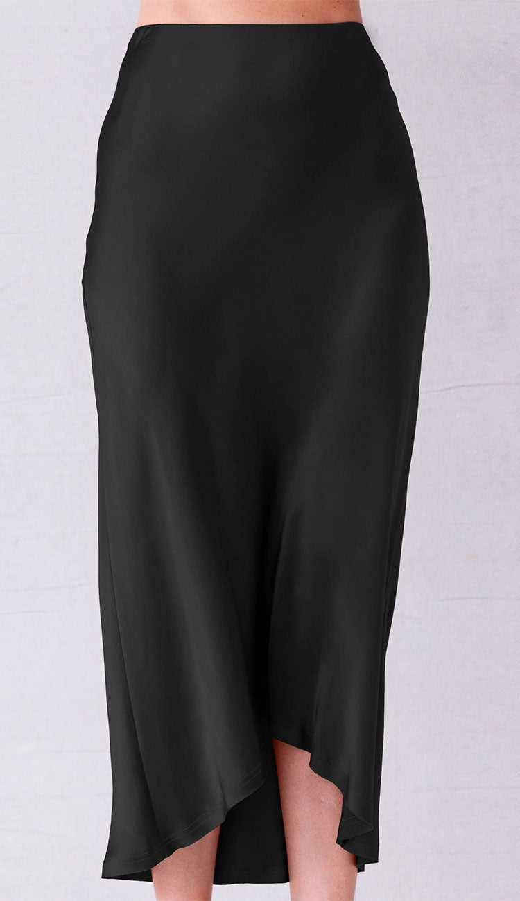 Go Silk Black skirt worn by a person on a light gray background