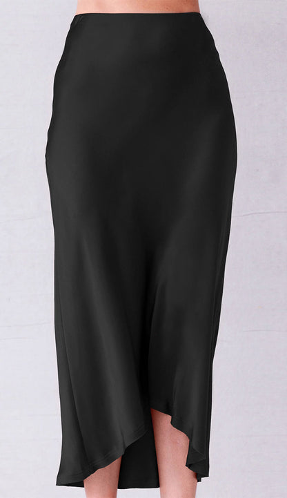 Go Silk Black skirt worn by a person on a light gray background