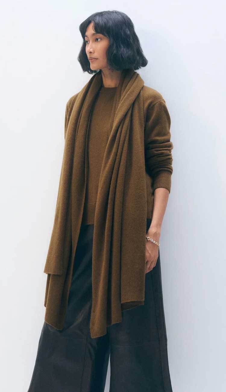 White + Warren cashmere travel wrap in Golden Brown, a lightweight rectangular 100% cashmere wrap styled as a scarf.