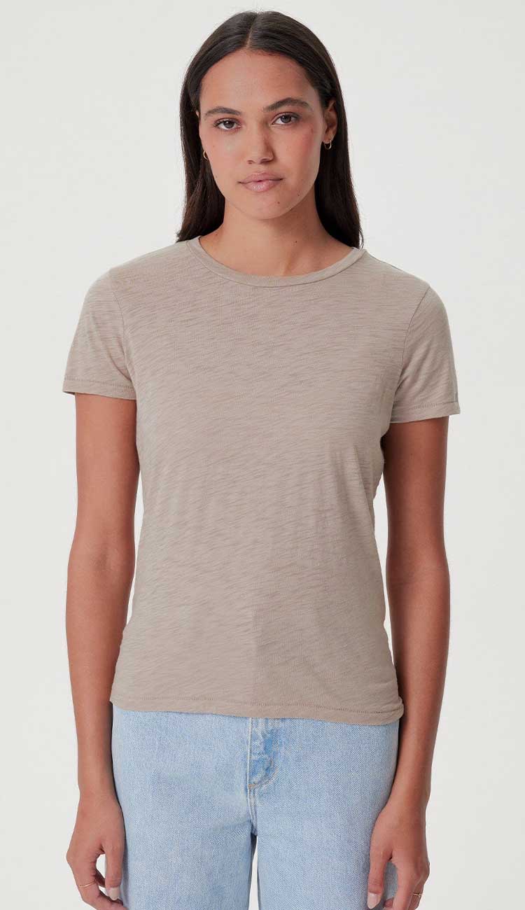 goldie boy tee in string beige color on a model on a white background