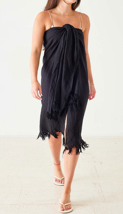Hermosa 3-Way Linen Wrap by MerSea in black tied as a sarong. A great Warm weather accessory. Makea. a great coverup. Paula & Chlo