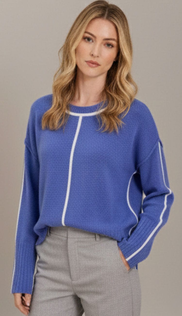 Front view of the Juliette Boxy Crewneck Pullover in Blue Bell Color, featuring a contrasting color "tipping" detail at the neckline and cuffs. The sweater has a relaxed, boxy fit with long sleeves and small side slits at the hem