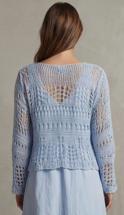 Woman wearing milio milano sky blue crochet top back view against a neutral background