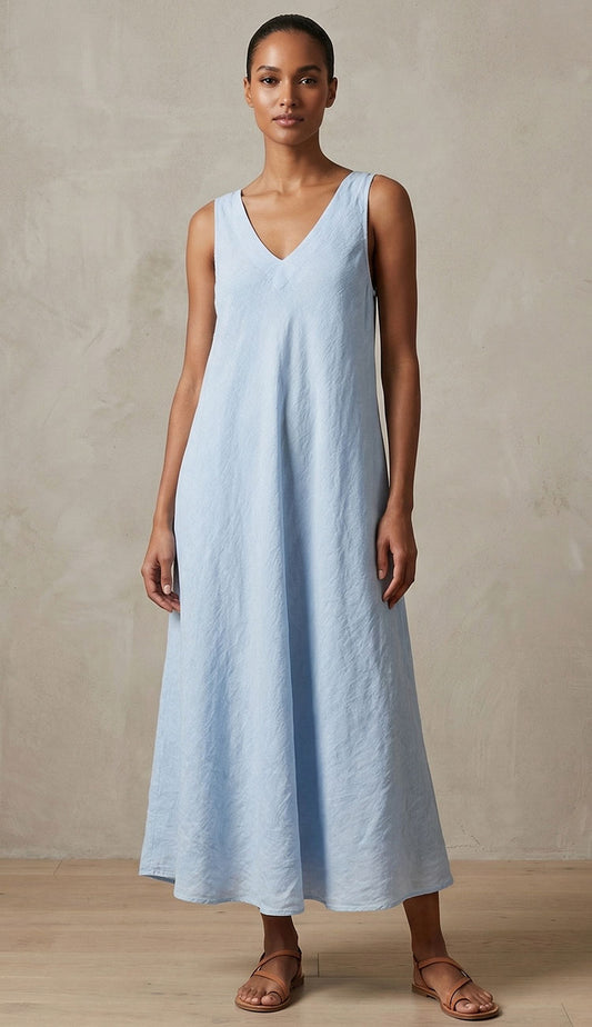 Woman wearing  Milio Milano Italian linen  light blue sleeveless dress against a neutral background