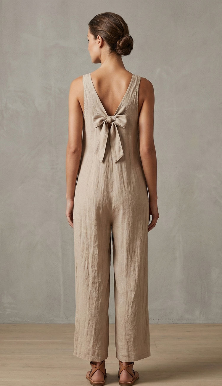 Women wearing milio milano linen v-neck back with bow on a taupe background.