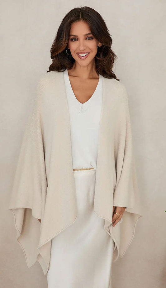 Woman wearing the milio milano knit dolman sleeve open cardigan wrap with classic ivory 