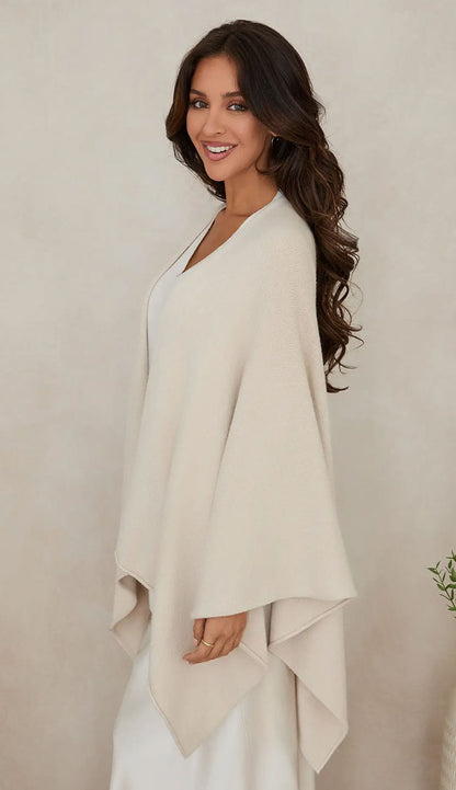 Woman wearing the milio milano knit dolman sleeve open cardigan wrap with classic ivory - side view