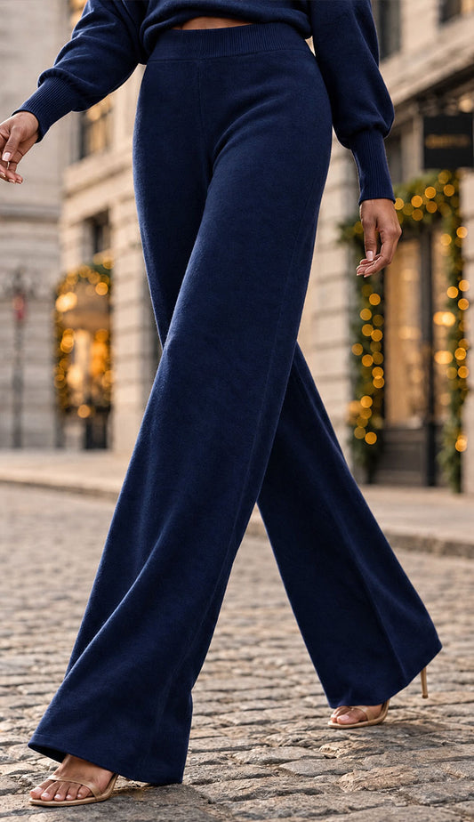 mili milano viscose flaire pants on a model  with high heel shoes 
