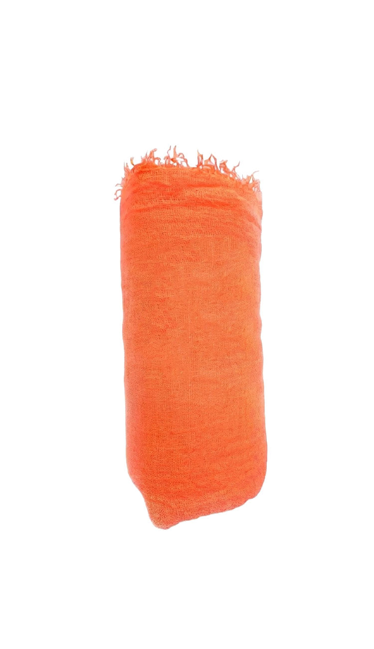 neon orange boho scarf on white background