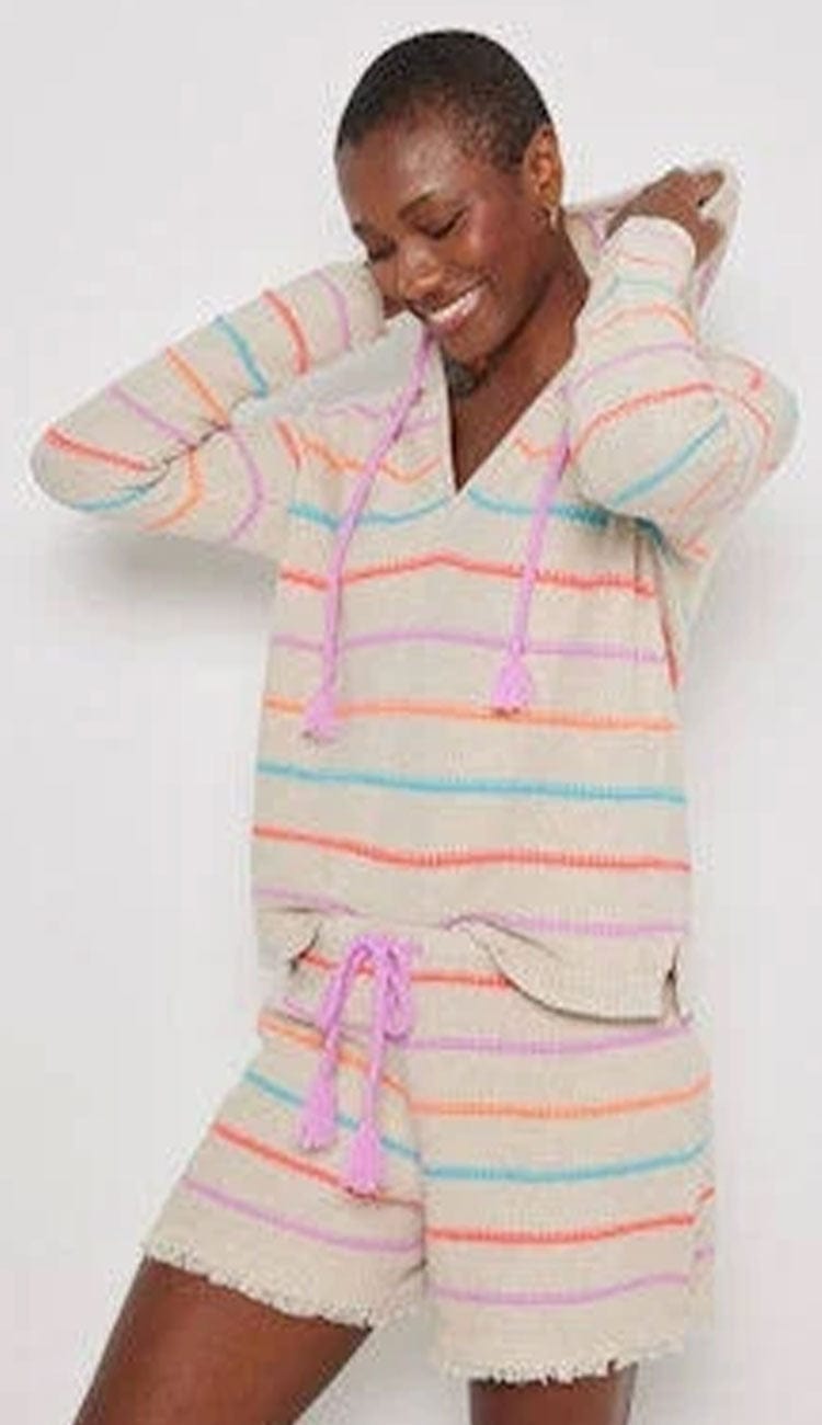 woman wearing a striped hoodie and matching shorts