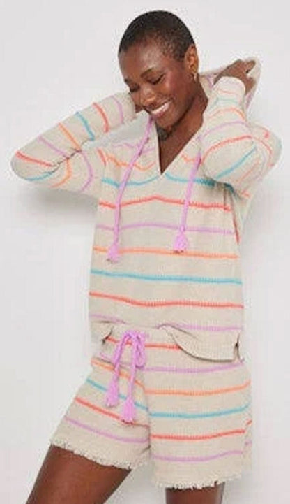 woman wearing a striped hoodie and matching shorts