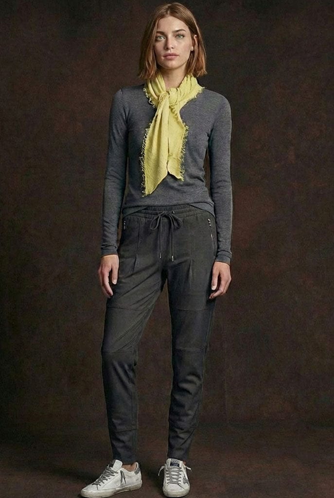 Woman wearing Raffaello Rossi Candy Pants in black, wearing a Goldie long sleeve tee with a Grisal mini love scarf in yellow.
