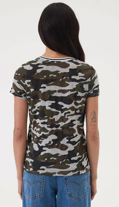 Person wearing a Goldiecamouflage t-shirt and blue jeans on a white background back view