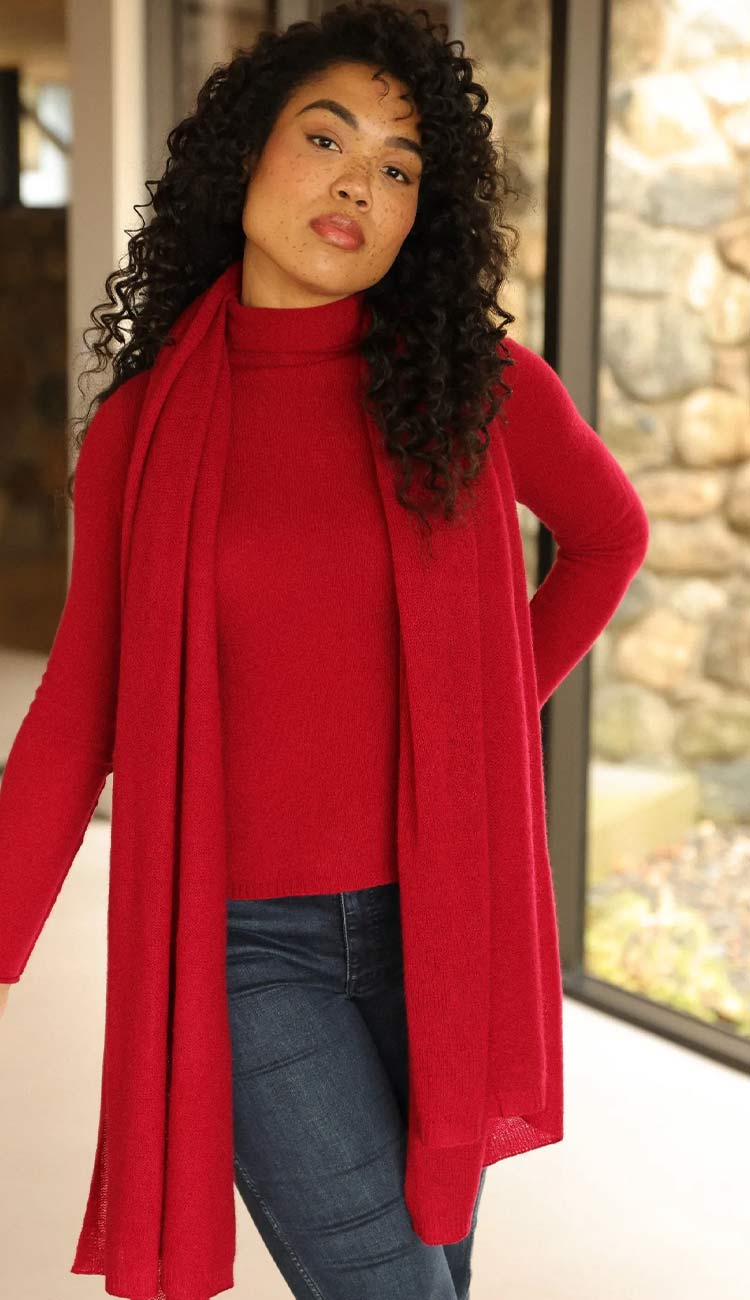 Alashan Red Velvet Breezy Travel Wrap over red sweater and blue jeans