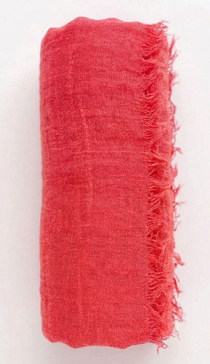 tomato Red fabric with frayed edges on a white background