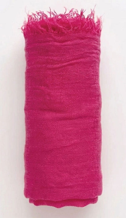watermelon fabric with frayed edges on a white background