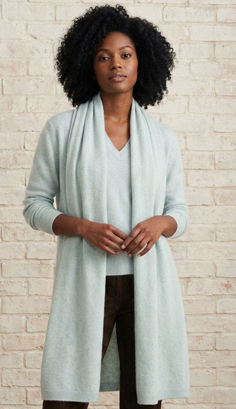 White + Warren cashmere travel wrap in Light Aqua, a lightweight rectangular 100% cashmere wrap styled as a scarf.