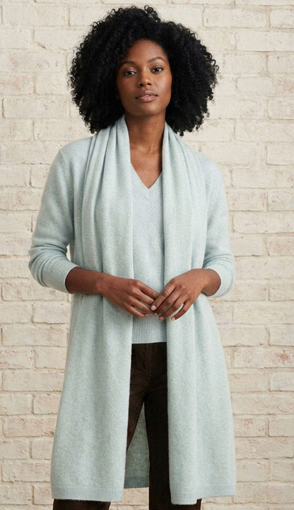 White + Warren cashmere travel wrap in Light Aqua, a lightweight rectangular 100% cashmere wrap styled as a scarf.